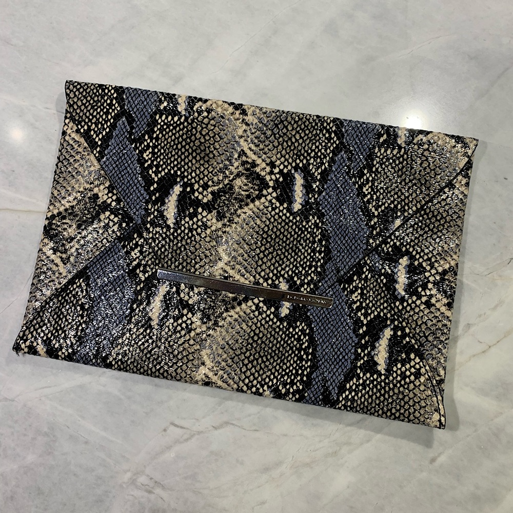 BCBG snakeskin envelope clutch with hits of blue